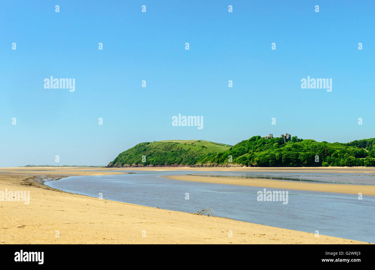 Ferryside Beach on the coast of Carmarthenshire in south Wales, in bright sunshine, showing the estuary of the River Tywi Stock Photo
