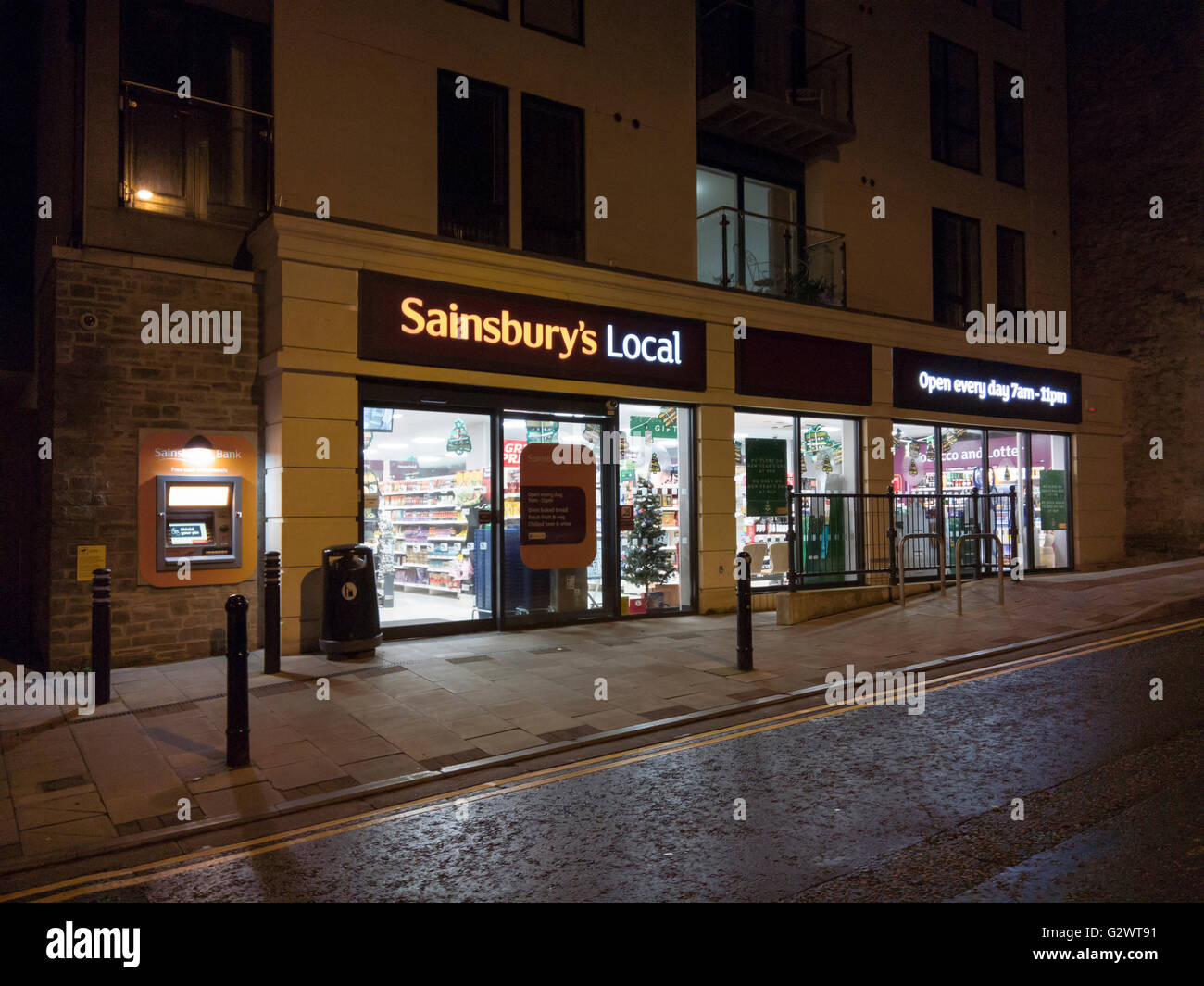 A Sainsbury's Local store at night. Clevedon, North Somerset, England