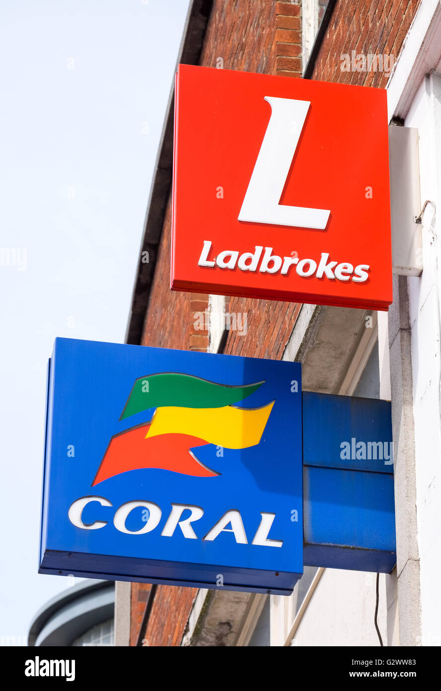 Coral and Ladbrokes betting shop signs next door to each other Stock Photo