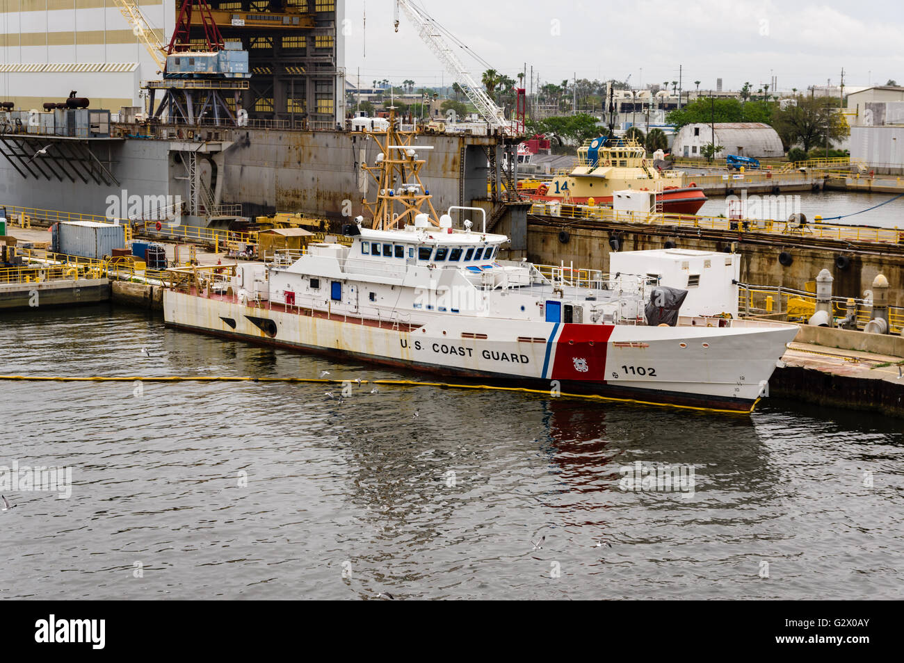 US Coast Guard Cutter 1102 docked near a repair dry dock in Tampa Bay ...