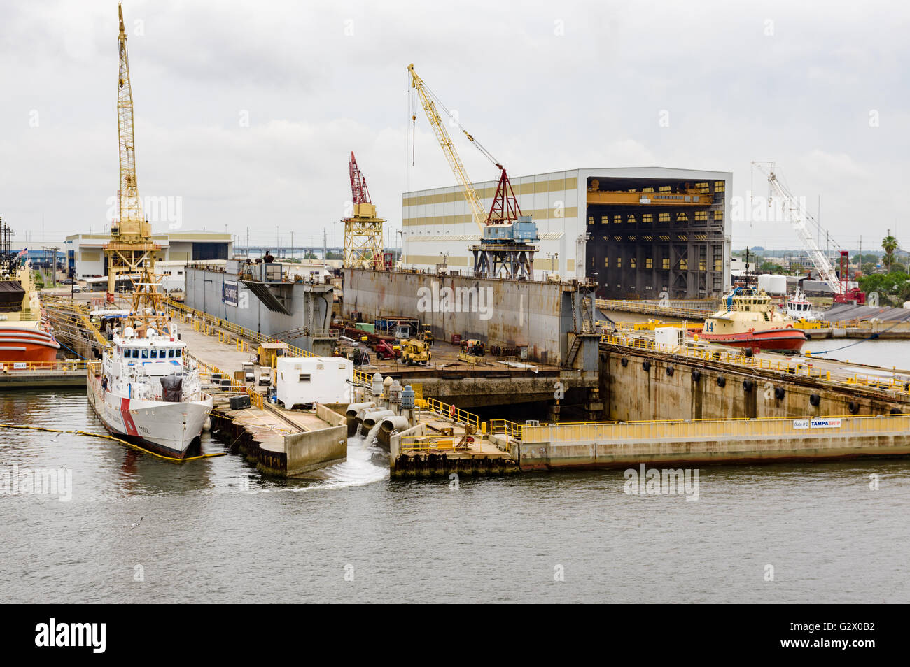 US Coast Guard Cutter 1102 docked near a repair dry dock in Tampa Bay ...