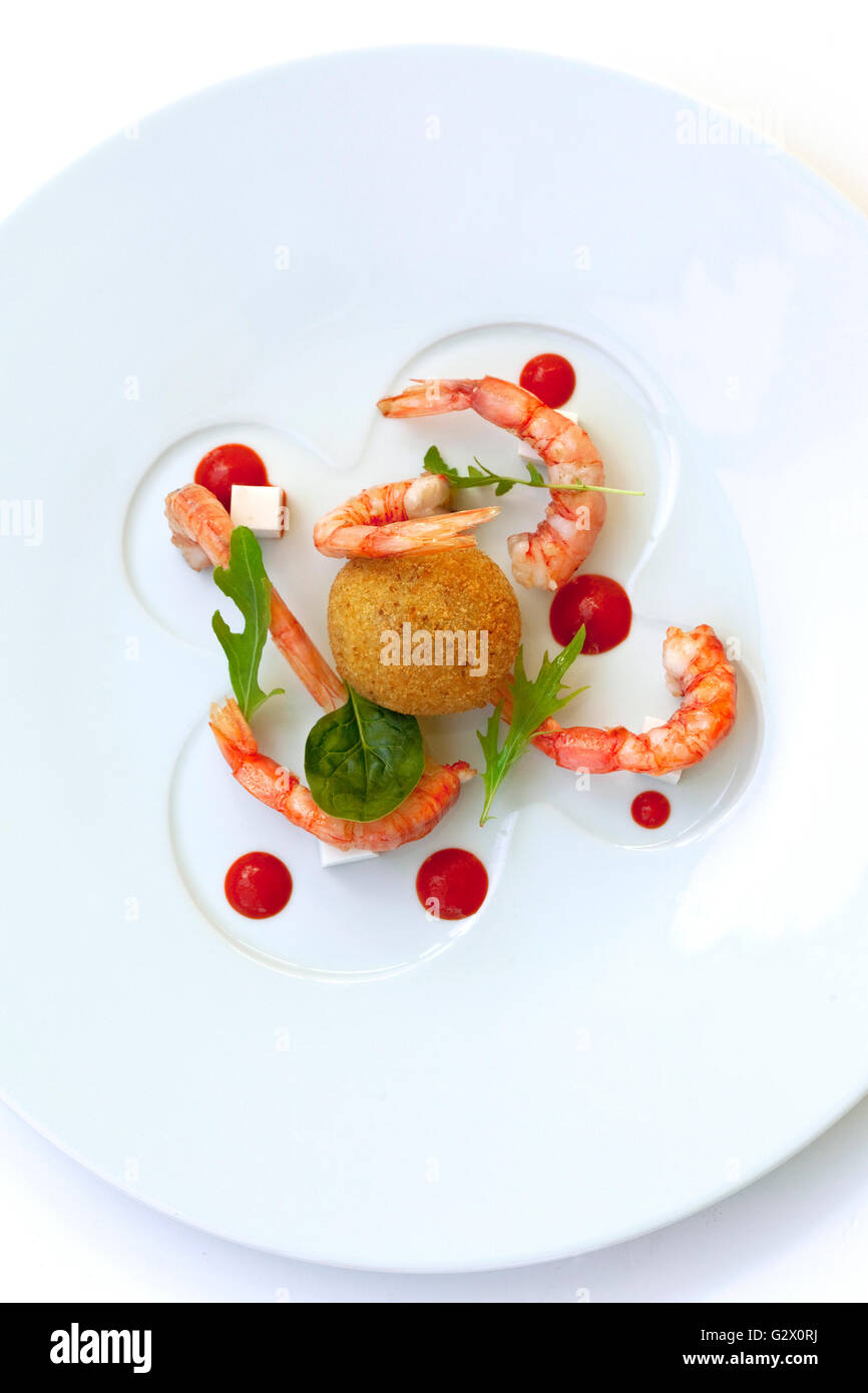 Risotto fritter, prawns and tomato sauce on a plate Stock Photo Alamy
