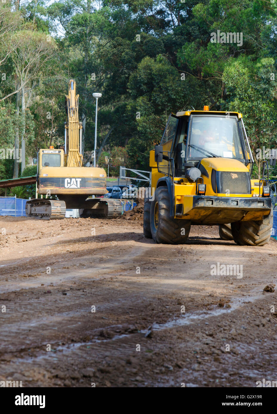 Excavators and earth moving equipment working on a construction site in Australia Stock Photo