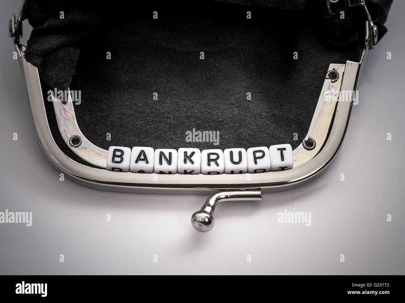 Wallet with bankrupt letters cube text, top view Stock Photo