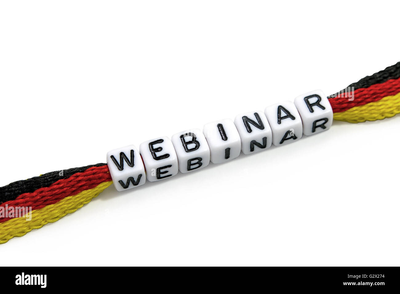Word webinar from letter cubes on German Flag, isolated Stock Photo