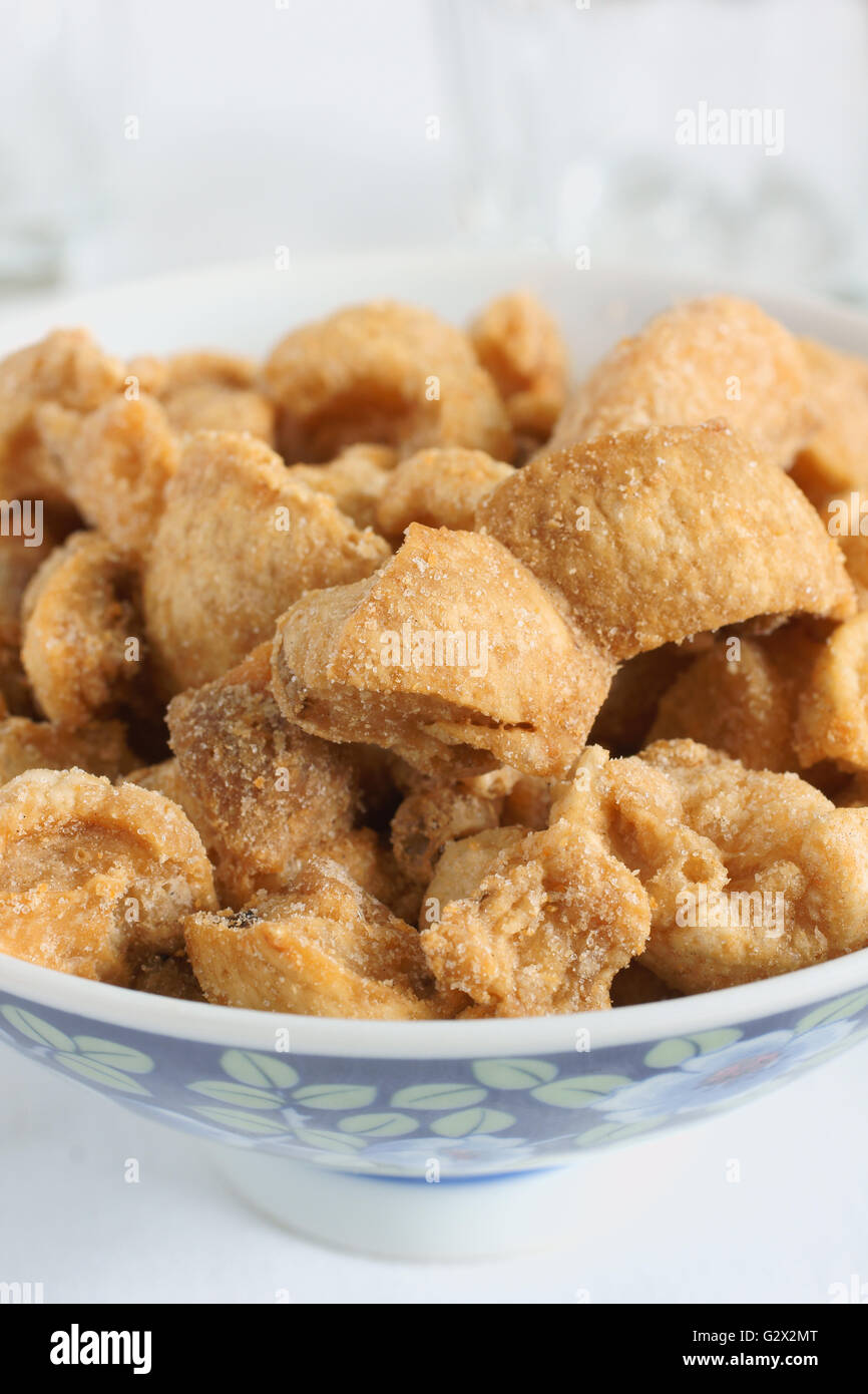 Pork scratchings deep fried pork rinds a popular snack Stock Photo Alamy