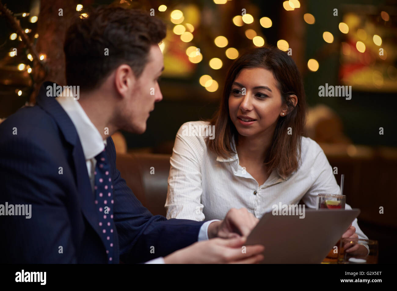 Business Colleagues Meeting In Bar After Work Stock Photo