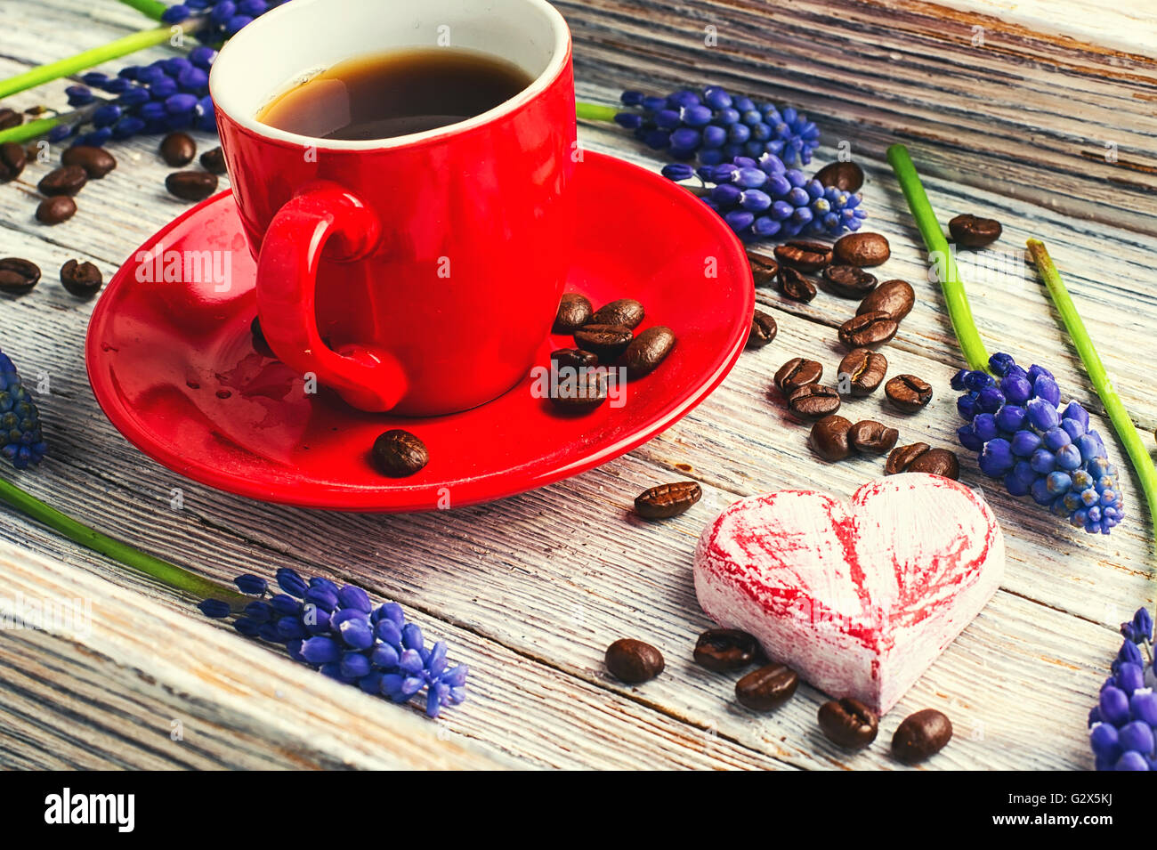 Red cup with coffee,flowers hyacinth and symbolic heart Stock Photo Alamy