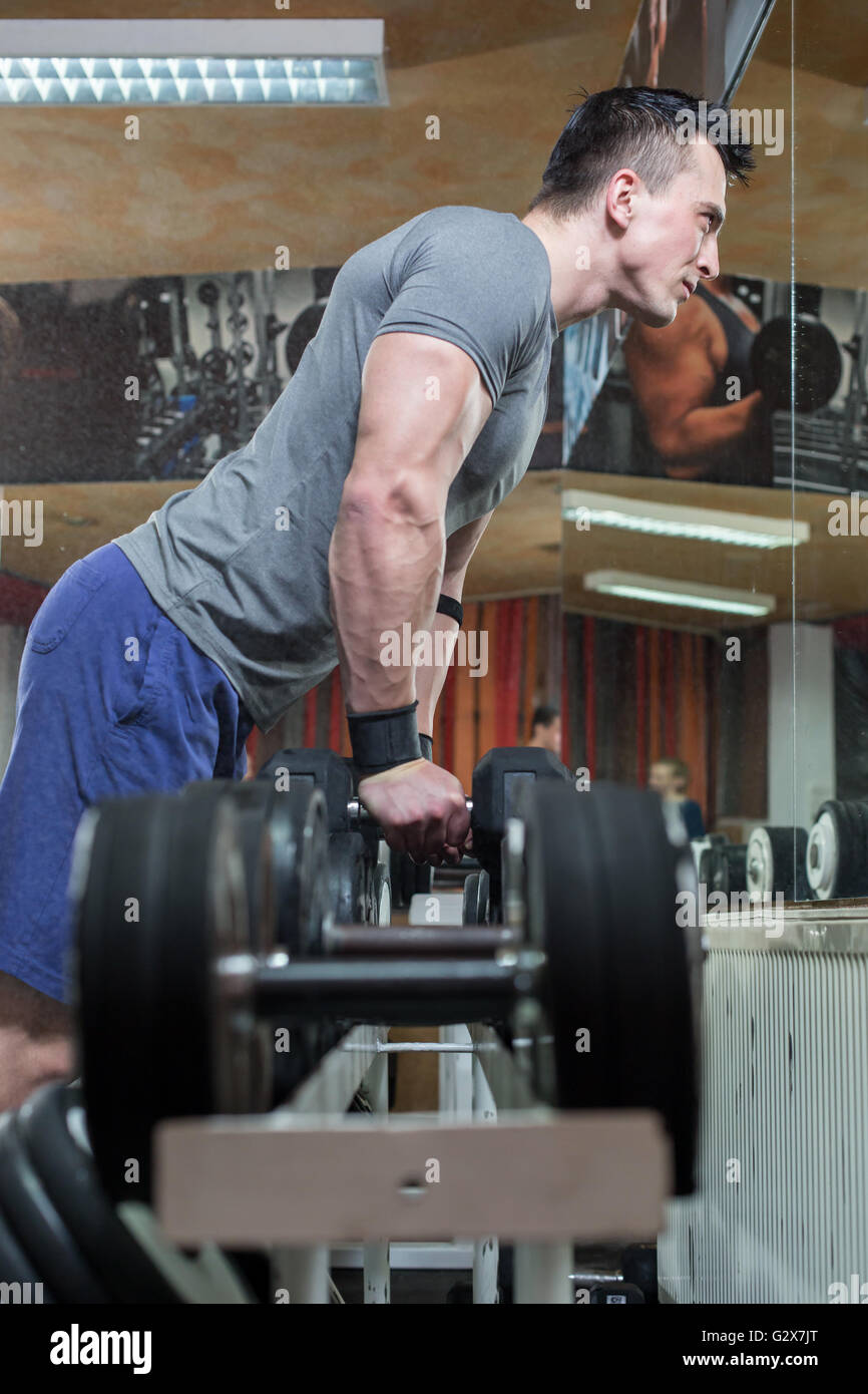 Young Man Working Out Biceps - Dumbbell Concentration Curls Stock Photo ...