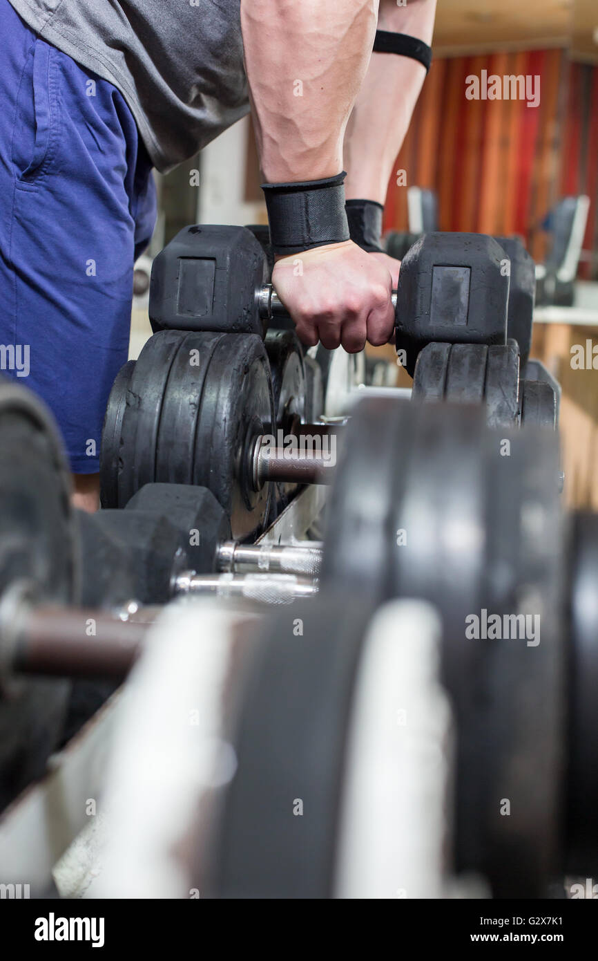 Young Man Working Out Biceps - Dumbbell Concentration Curls Stock Photo ...