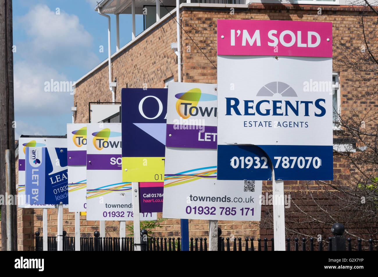 Estate agent signs outside apartments, Staines Road West, SunburyonThames, Surrey, England