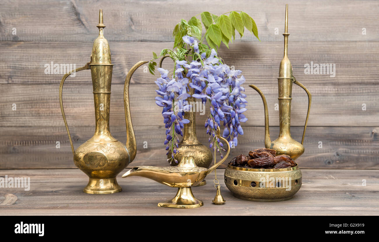 Vintage arabic jug, vase, lamp, tea pot. Fruits and flowers. Golden oriental decorations Stock Photo
