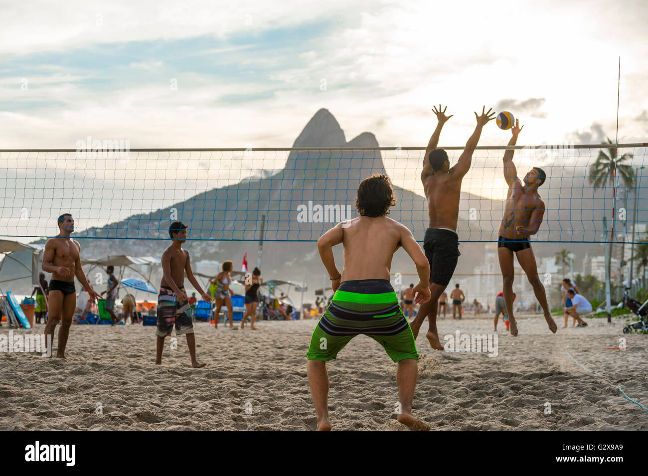 RIO DE JANEIRO - MARCH 27, 2016: Brazilians play futevôlei (footvolley, a sport combining football/soccer and volleyball). Stock Photo