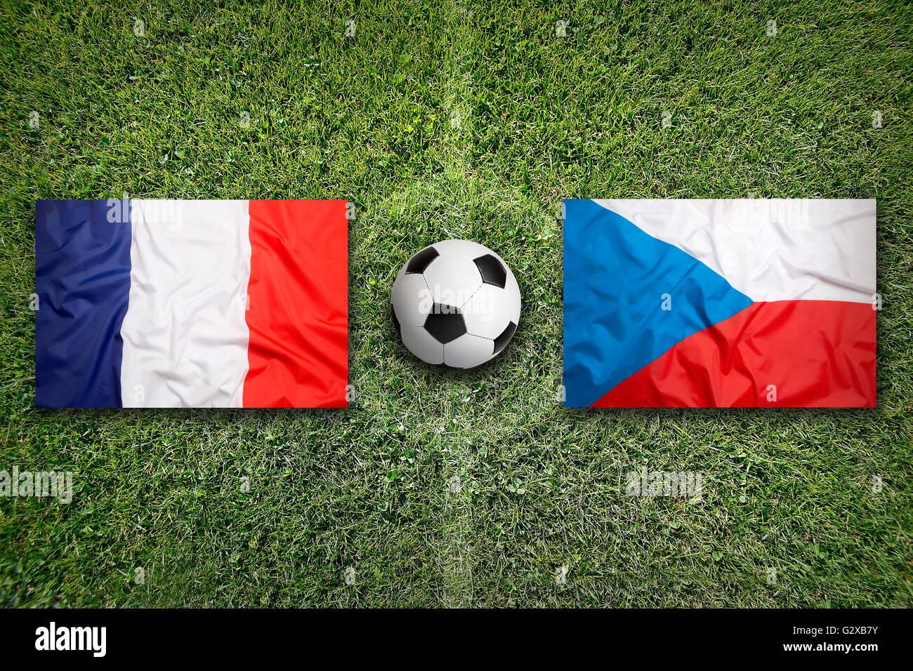 France vs. Czech Republic flags on a green soccer field Stock Photo