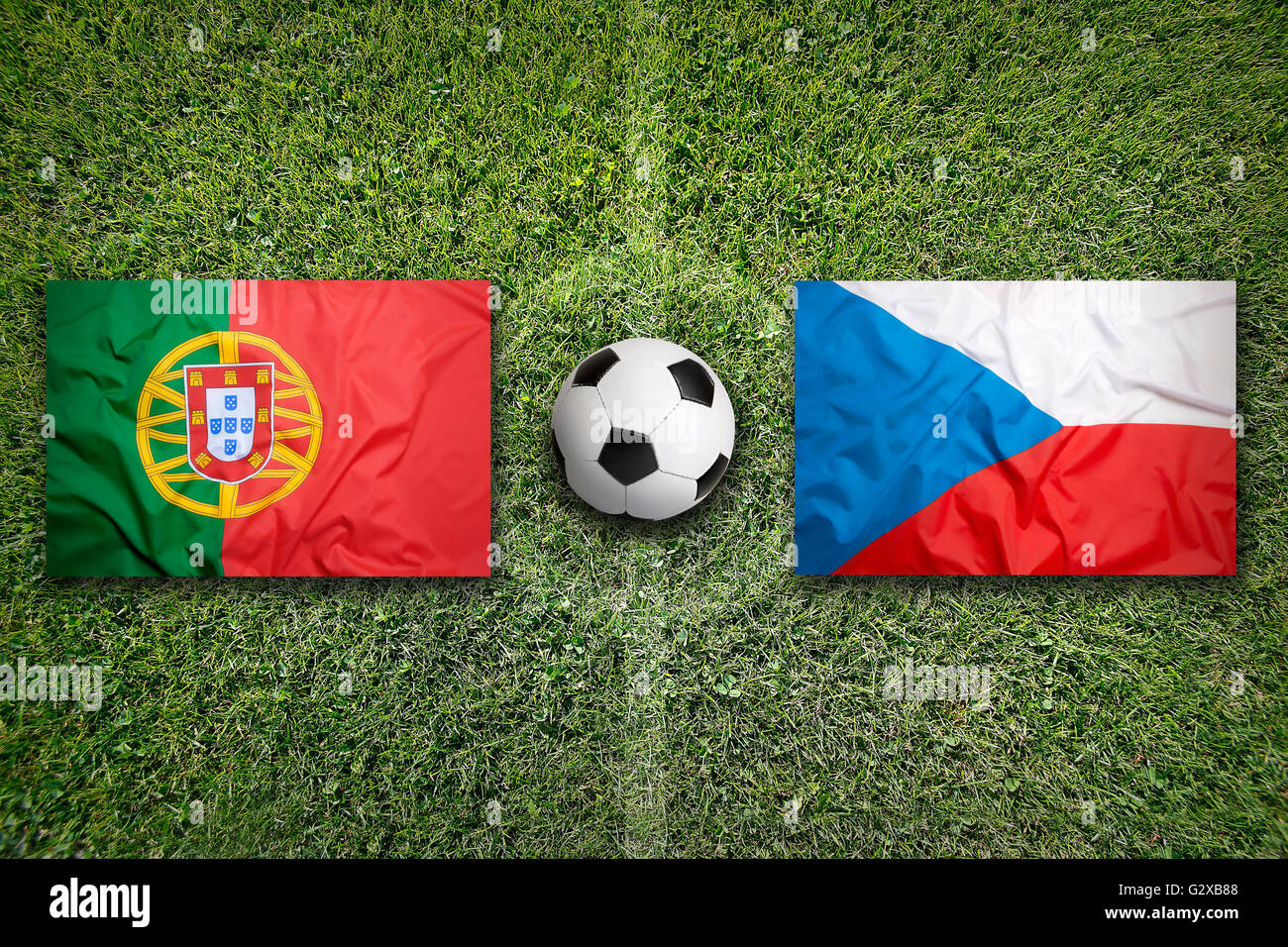 Portugal vs. Czech Republic flags on a green soccer field Stock Photo