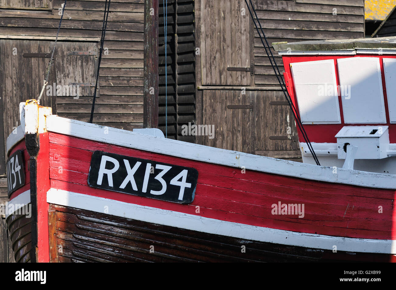 Fishing boat and net sheds at Hastings, East Sussex, UK Stock Photo