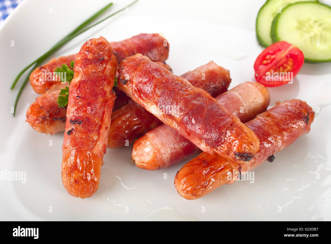 Sausages with bacon Stock Photo Alamy
