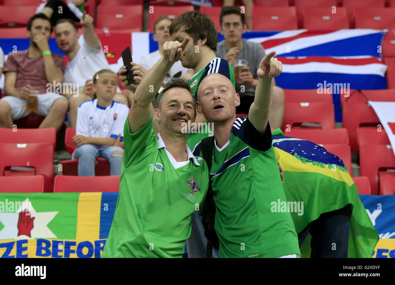 Northern Ireland fans in the stands during the International Friendly match at the Antona Malatinskeho Stadium, Trnava, Slovakia. PRESS ASSOCIATION Photo. Picture date: Saturday June 4, 2016. See PA story SOCCER Slovakia. Photo credit should read: Jonathan Brady/PA Wire. Stock Photo