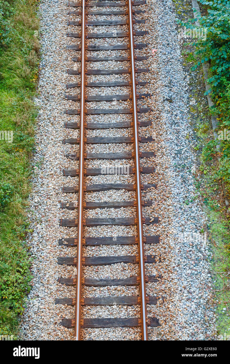 Railway track with wooden sleepers seen from above Stock Photo