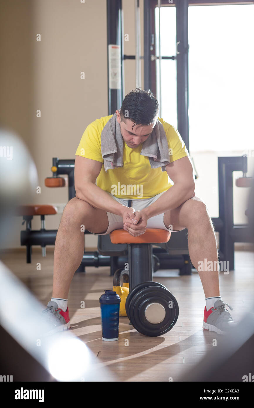 Athlete muscular brutal bodybuilder emotional posing in the gym ...