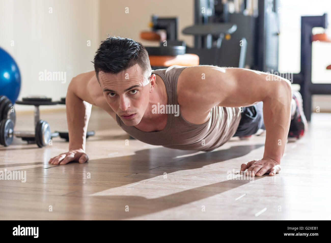 Handsome fit man exercising a the gym Stock Photo - Alamy