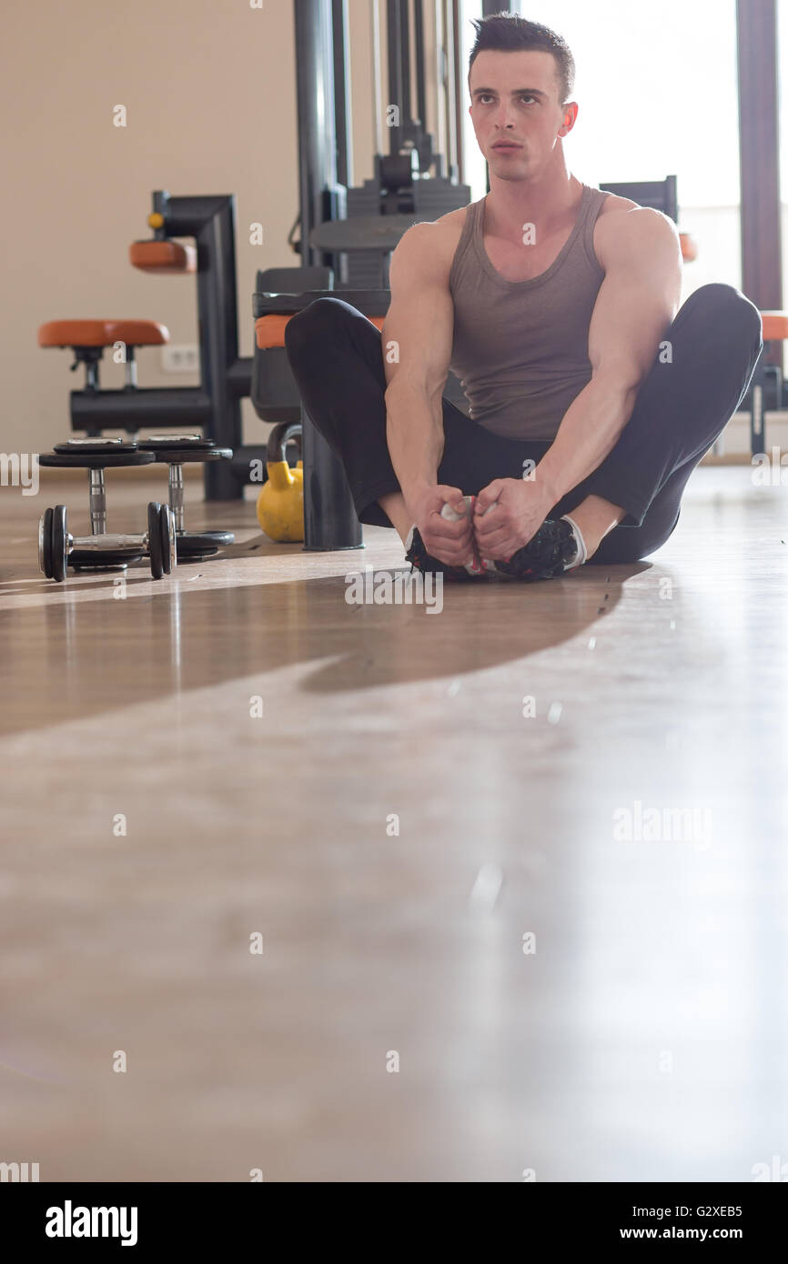 Handsome young man stretching in hi-res stock photography and images ...