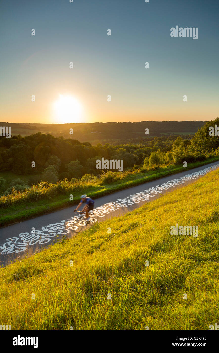 Cyclist on the Zig Zag Box Hill Dorking Surrey Hills sunset Richard Long Stock Photo