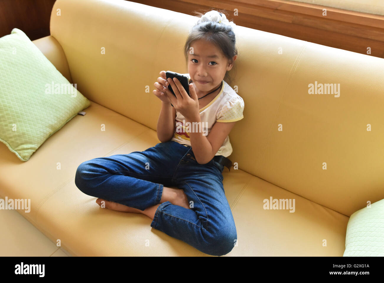 Girl on her mobile phone Laos Stock Photo