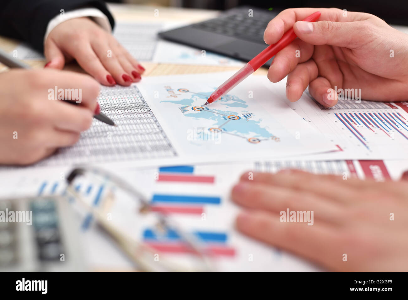 co worker hands during paperwork at meeting Stock Photo