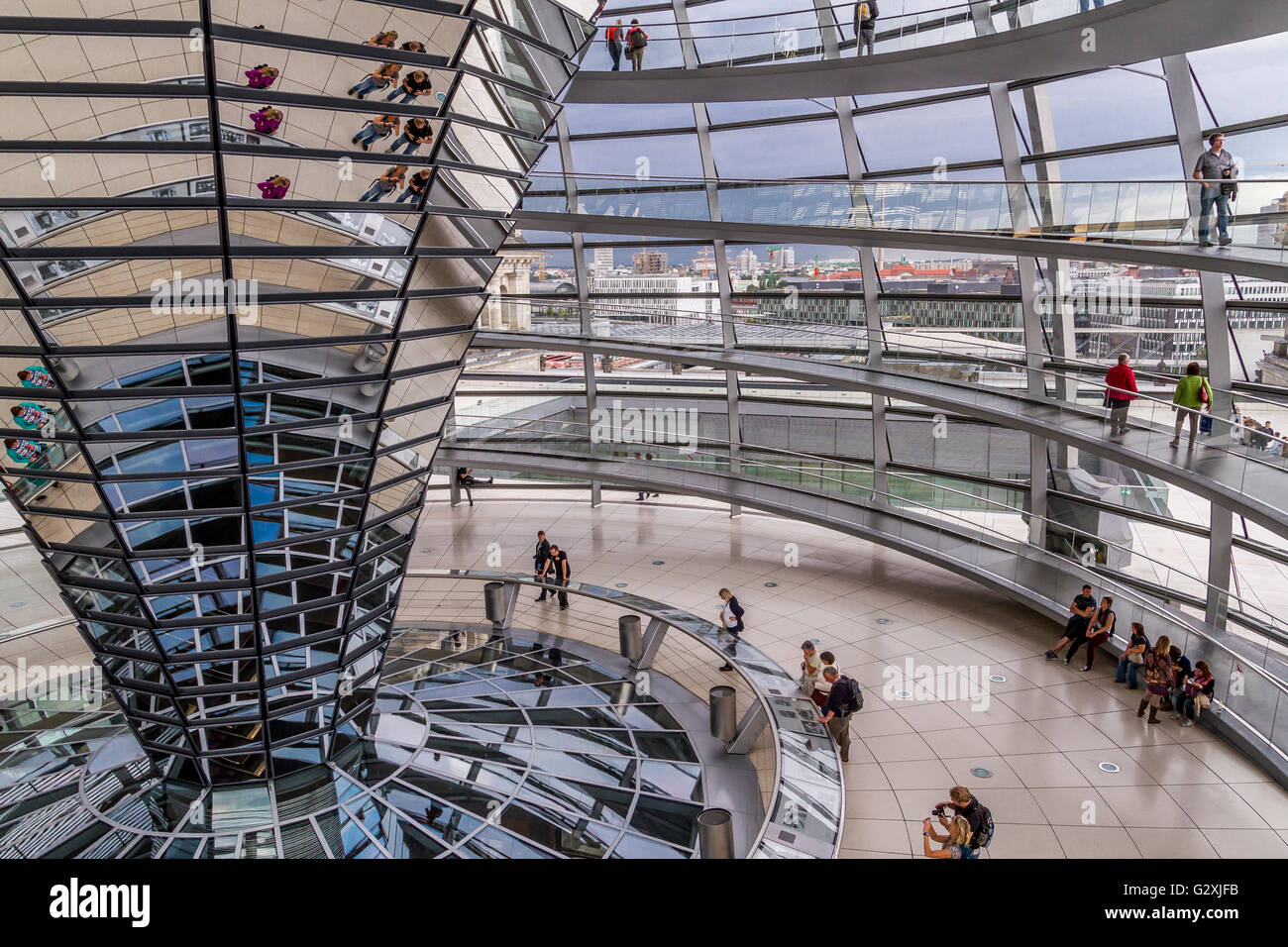 The interior of the glass dome of The Reichstag Building ,which houses the German Bundestag or German Parliament designed by Sir Norman Foster, Berlin Stock Photo