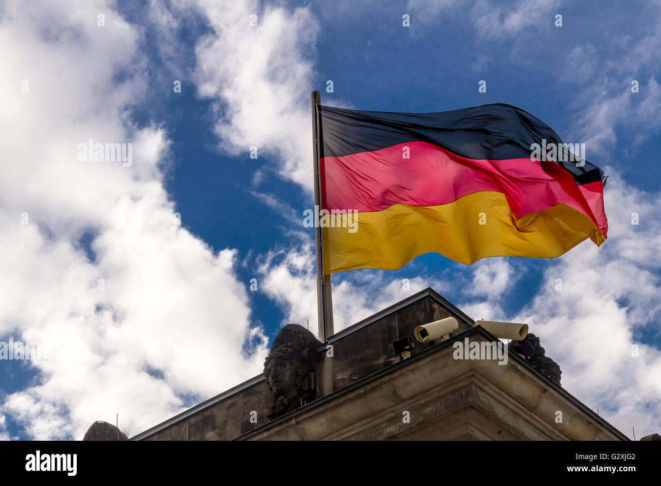 The flag of the Federal Republic of Germany , The German flag is a  tricolour, with three equal horizontal stripes of black, red and gold. Stock Photo