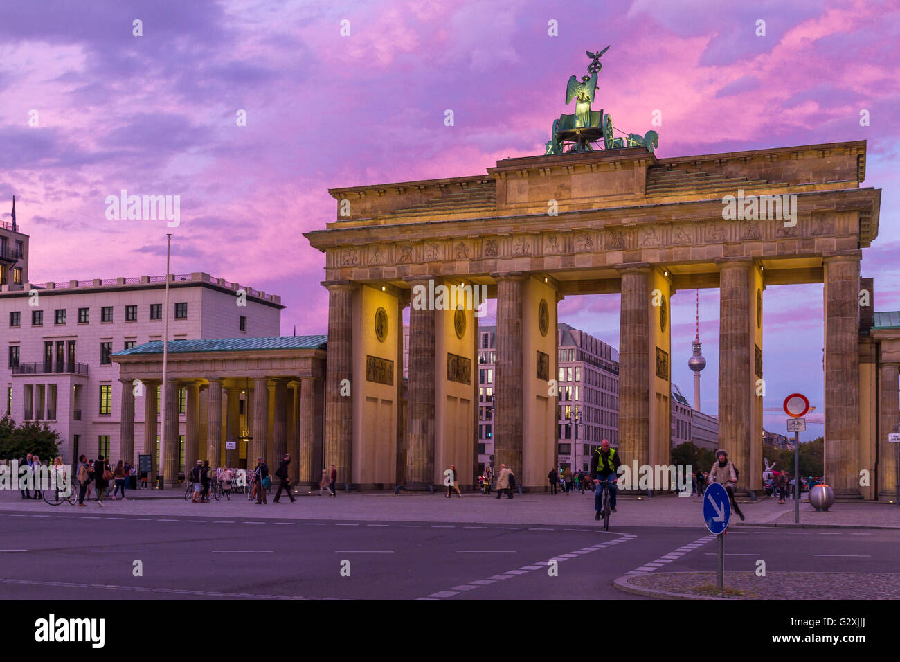 People visiting the Brandenburg Gate ,an 18th-century neoclassical world famous monument in Berlin at sunset ,Germany, Berlin ,Germany Stock Photo
