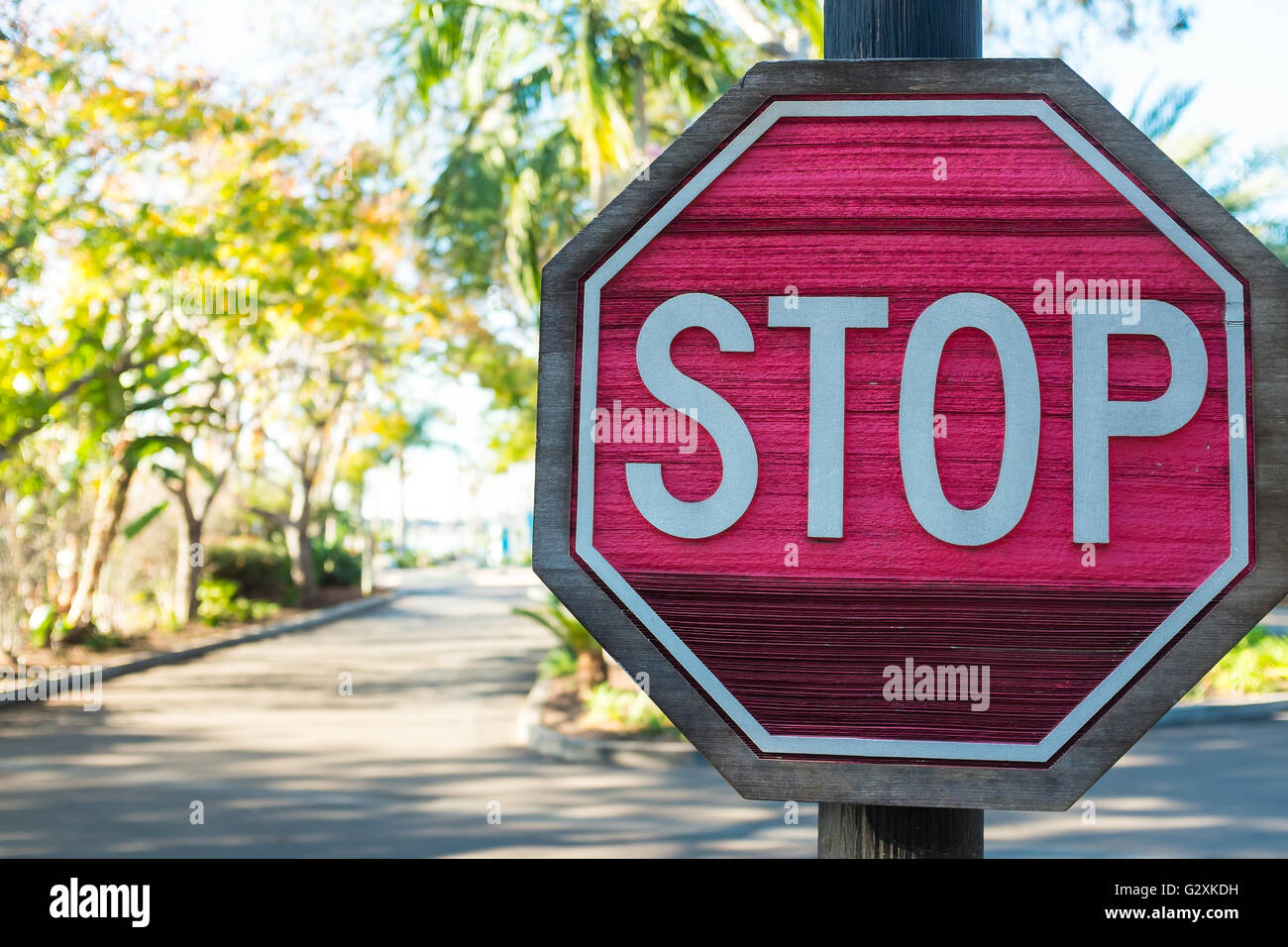 A wooden stop sign at roadside Stock Photo - Alamy