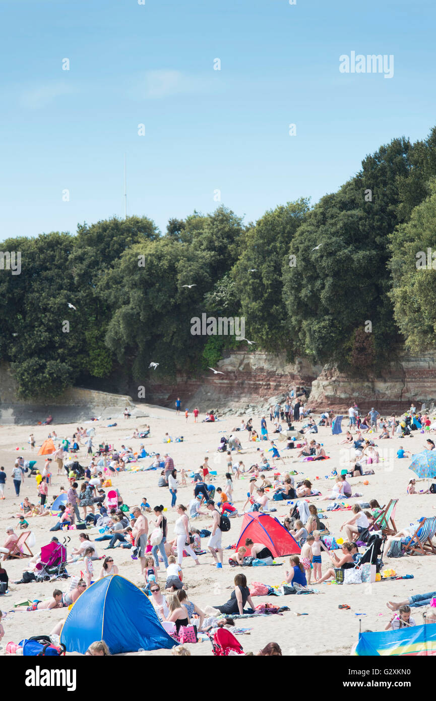 A busy Whitmore Bay beach at Barry Island, Barry, South Wales on a warm summers day. Stock Photo