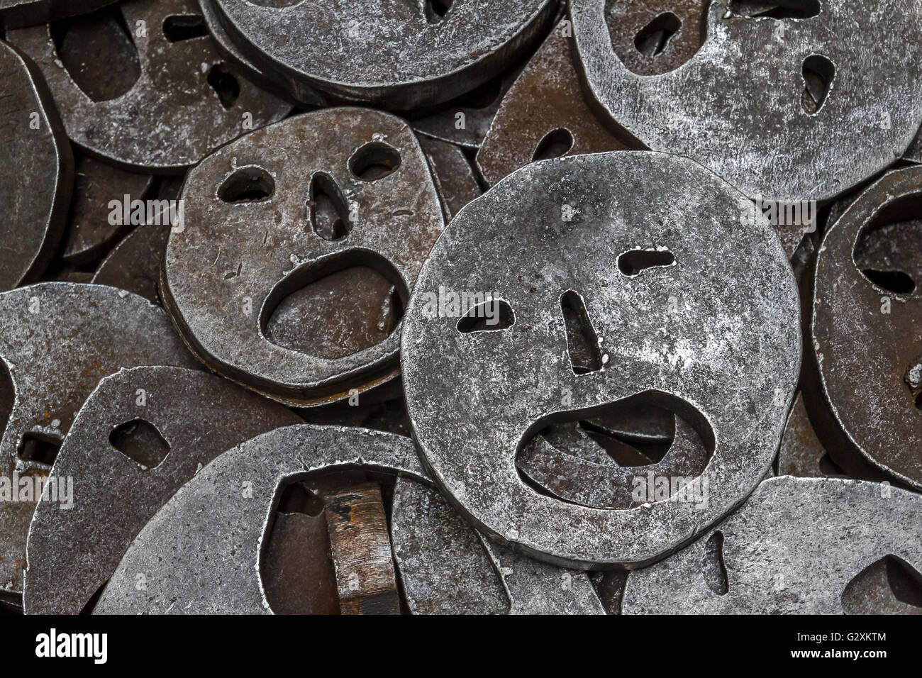 Shalekhet - fallen leaves,installation of metal faces with open mouths, cut from heavy round iron plates covers the floor,in The Jewish Museum Berlin Stock Photo