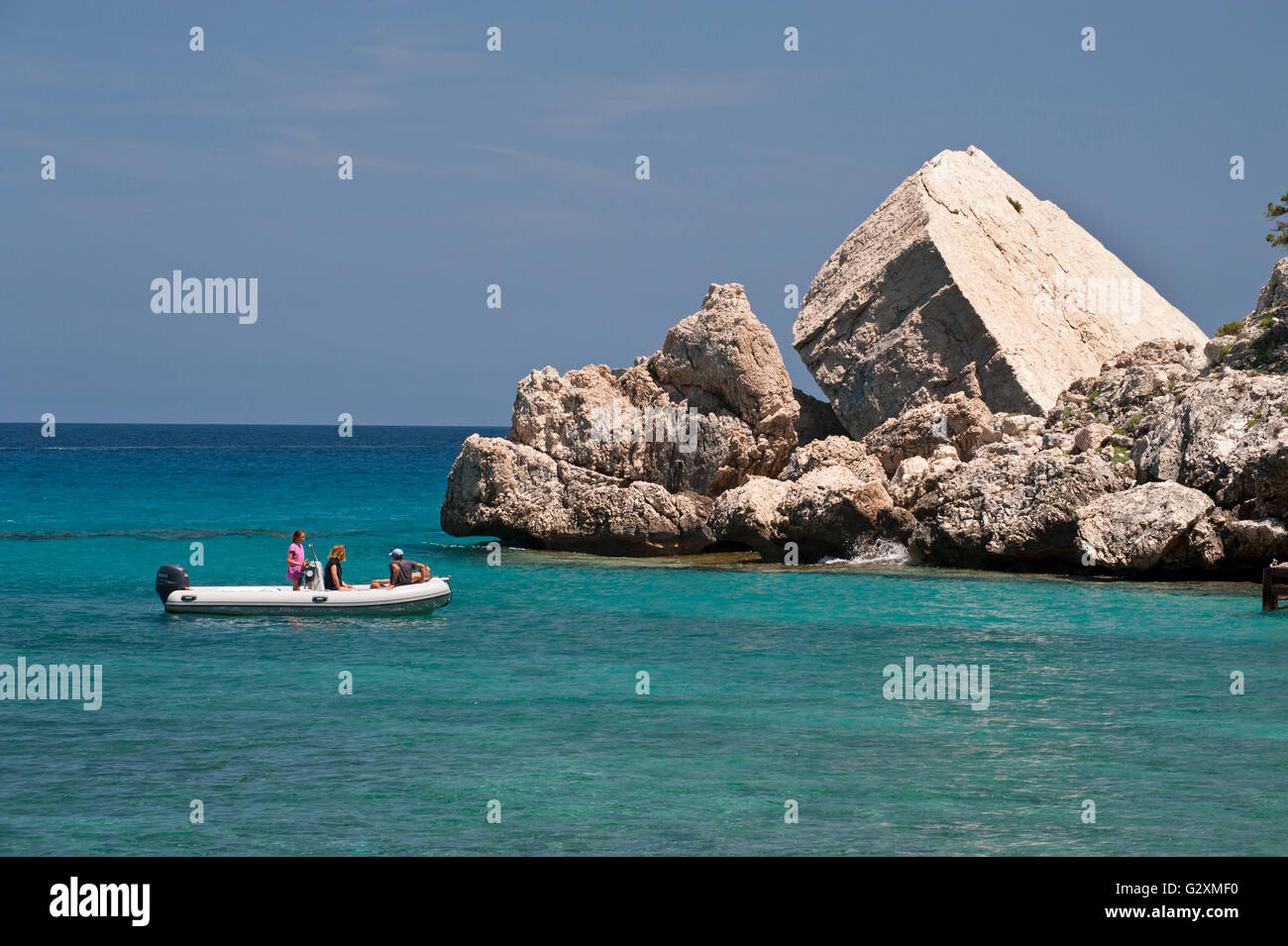Cala Gonone,Dorgali,Sardinia,Italy, 25/5/2016.A boat sails along the rocky coast at the famous Cala Luna beach, Orosei gulf. Stock Photo