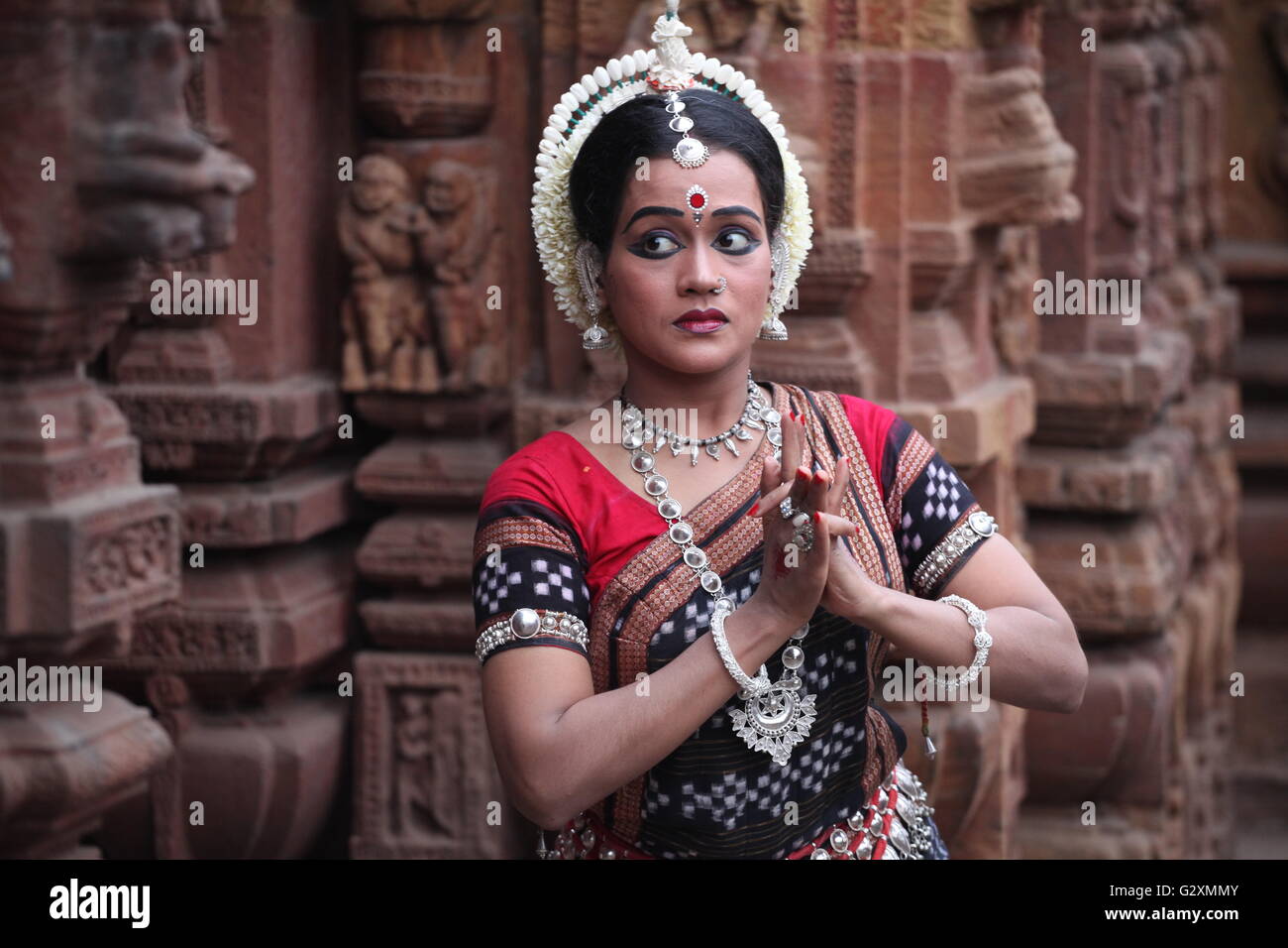 an odissi dancer narrating a sequence using mudra and abhinaya Stock Photo