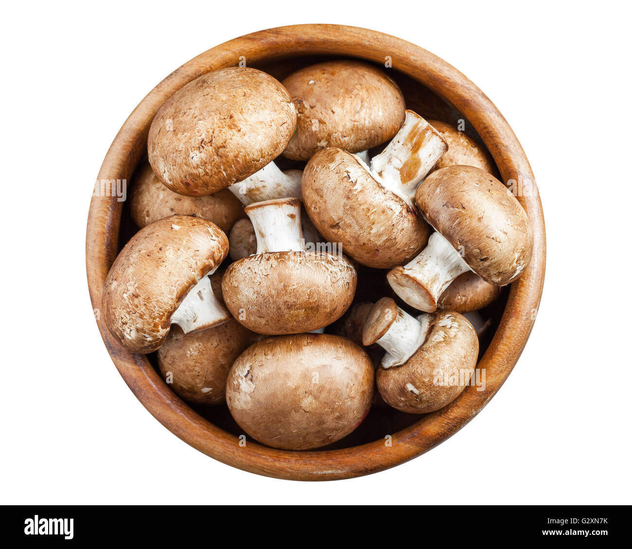 Mushrooms in wooden bowl isolated on white. Top view. Stock Photo
