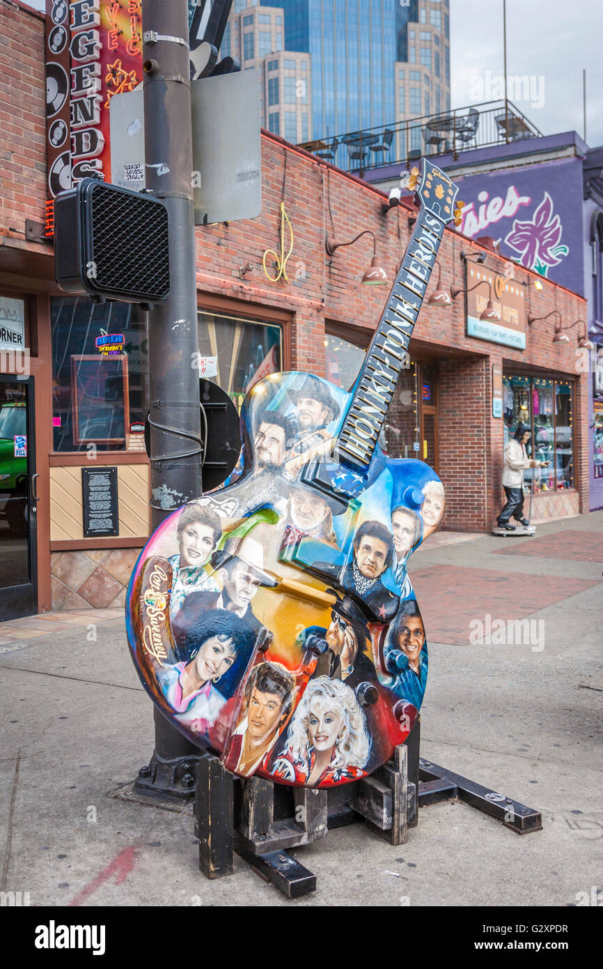 Guitar painted with country music legends outside Legends Corner bar in The District in downtown Nashville, Tennessee Stock Photo