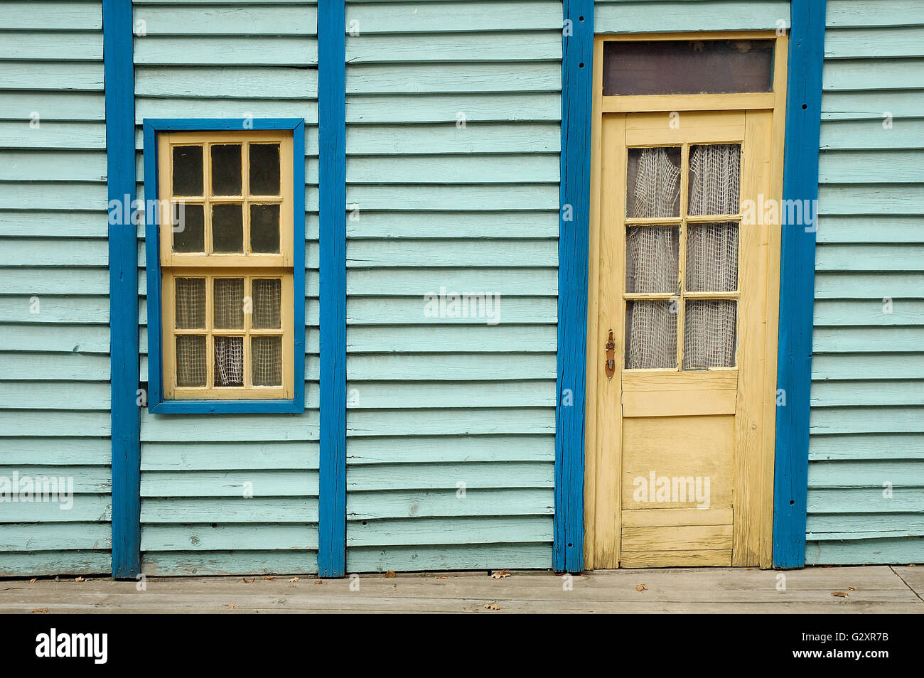Blue wooden wall with window and door Stock Photo - Alamy