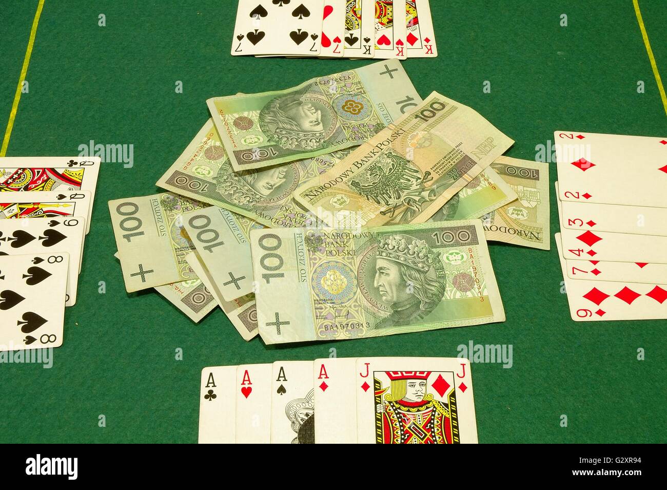 poker cards and cash on poker table. currency polish zloty stock