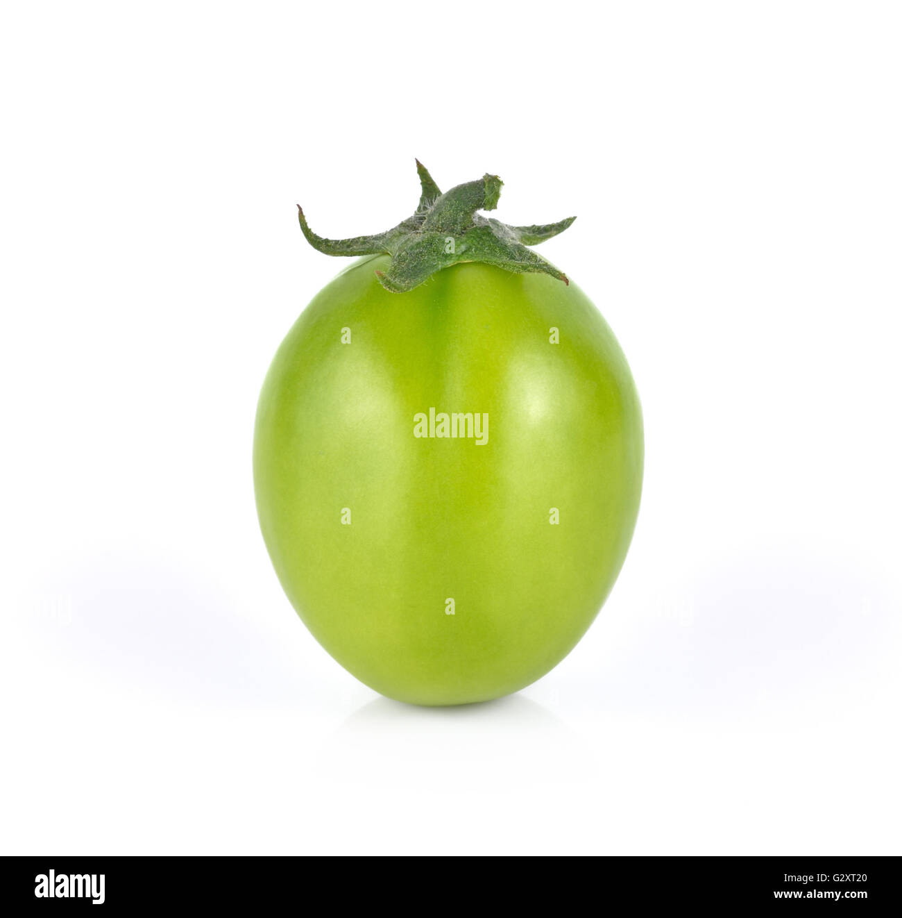 green tomato on white background Stock Photo - Alamy