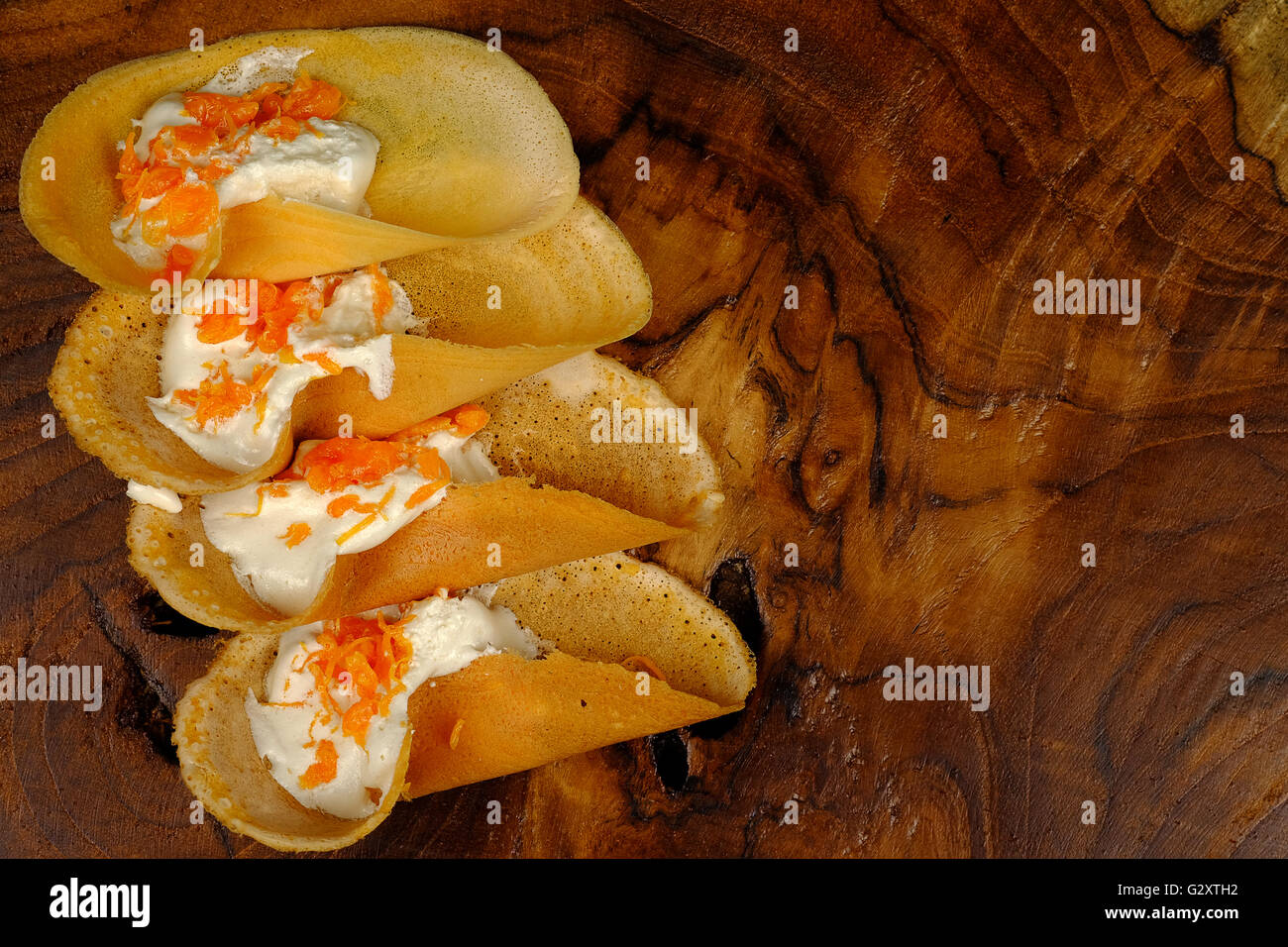 Khanom Beaung Thai or a kind of filled pancake Thai food or Thai Style Crisp Tart on tray, Thailand - (Selective focus) Stock Photo