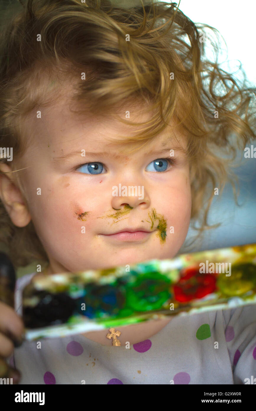 the little girl for the first time draws paints Stock Photo - Alamy