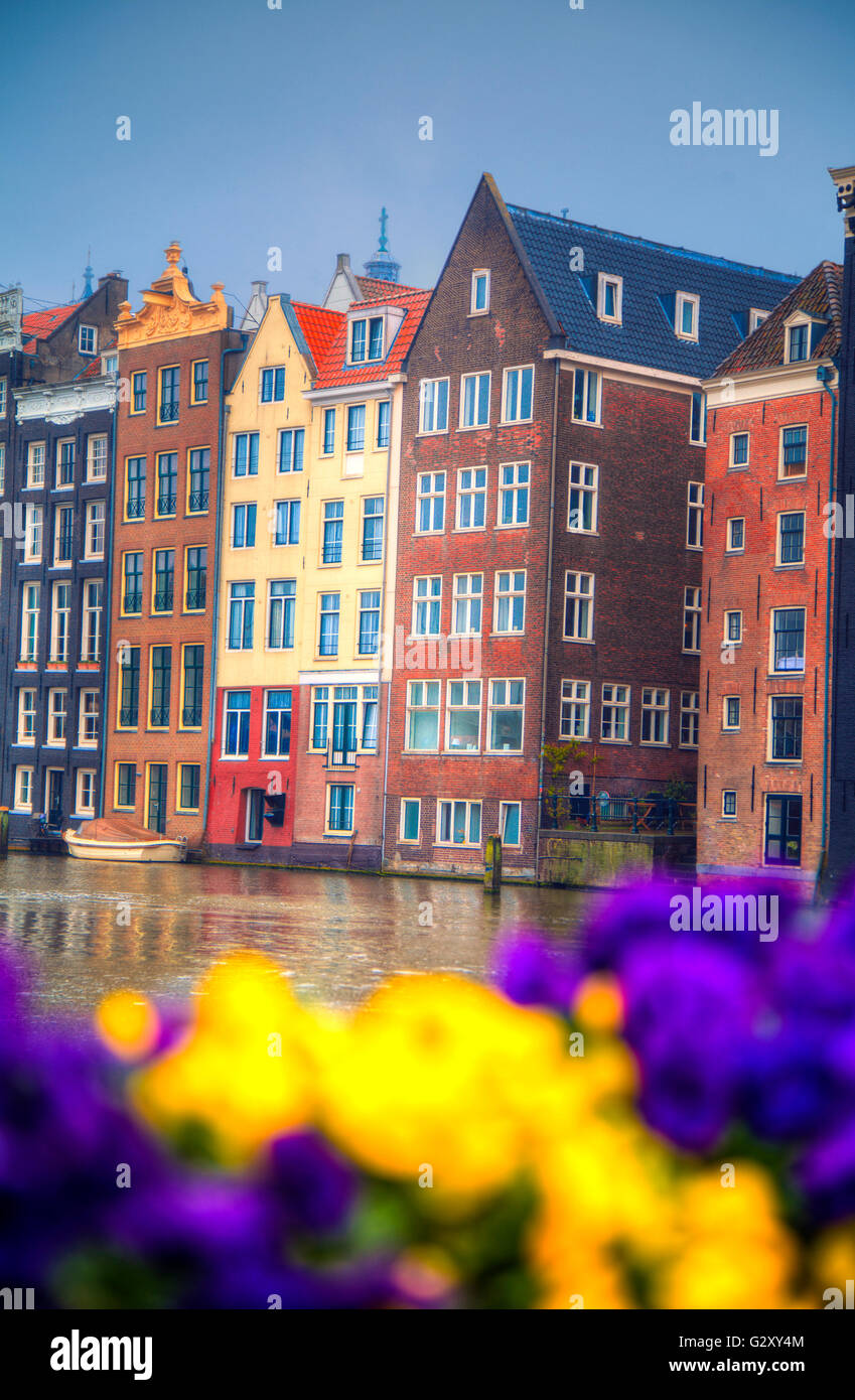 Amsterdam in the spring. Houses are along the canals. Holland Stock Photo