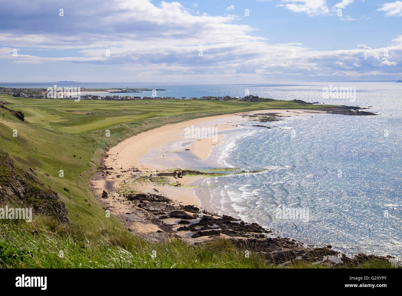 View to sandy beach in West Bay with village beyond on Firth of Forth coast seen from Kincraig Hill. Elie and Earlsferry East Neuk Fife Scotland UK Stock Photo