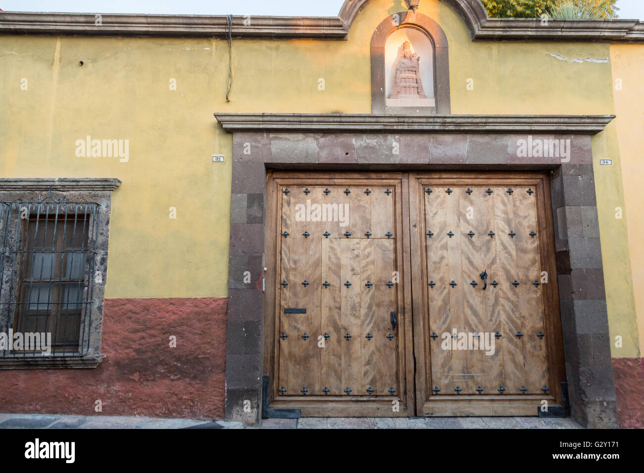 A traditional hacienda style painted wooden door on a historic home in San  Miguel de Allende, Mexico Stock Photo - Alamy