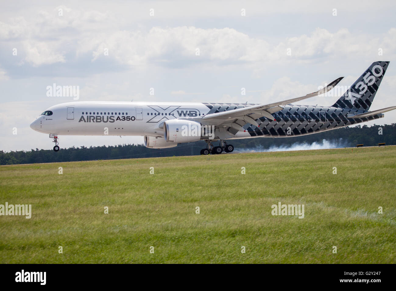 BERLIN / GERMANY - JUNE 3,2016: Airbus A 350 - 900 plane lands on airport in Berlin / Germany on June 3, 2016. Stock Photo