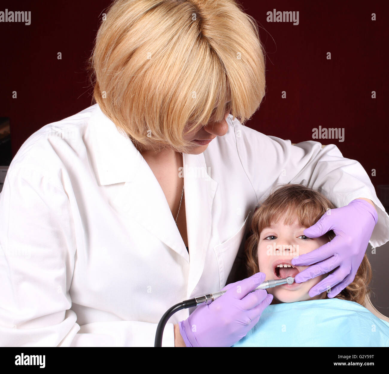 dentist perform a dental exam Stock Photo