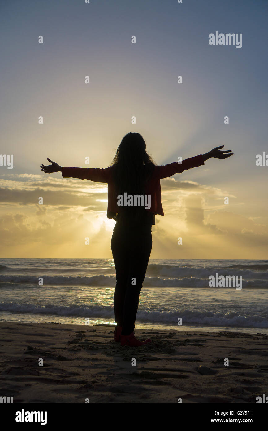 Girl standing arms outstretched hi-res stock photography and images - Alamy